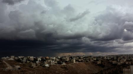 White Concrete Buildings Under Cloudy Sky