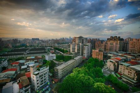 White Concrete City Buildings Under White Blue Sky at Daytime