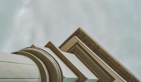 White Concrete Pedestal Column Facing the Rainy Sky