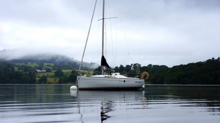 White Fishing Boat on the Body of Water during Daytime