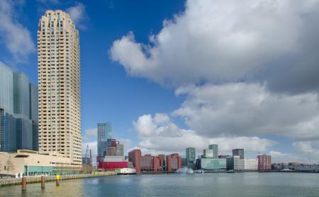 White High-rise Building Near Water