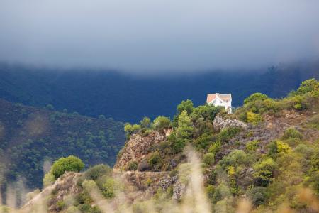 White House on Mountain during Cloudy Day
