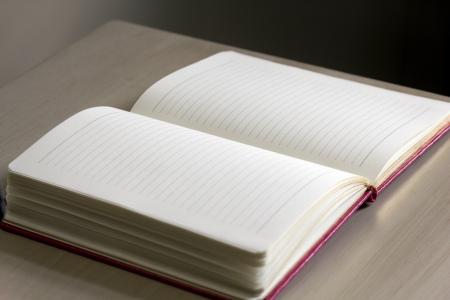 White Lined Notebook on Gray Table