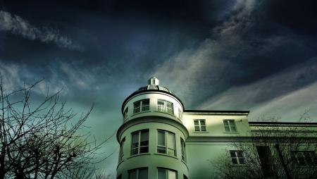 White Painted House Under Cloudy Sky