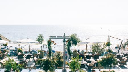 White Patio Table Set Near Ocean