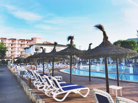 White Plastic Beach Loungers Near Pool at Daytime