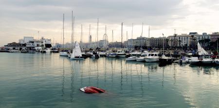 White Power Boat and Yacht Parked on Body of Water