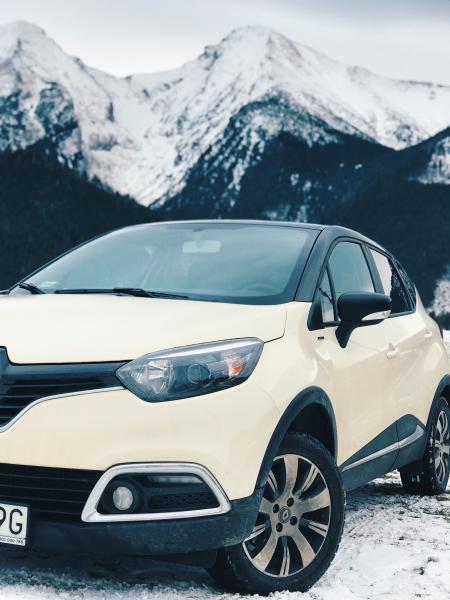 White Renault Clio 4 on Snow Covered Road