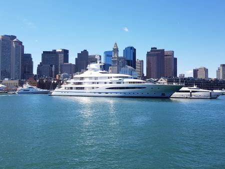 White Ship in a Distance of Skyline Buildings