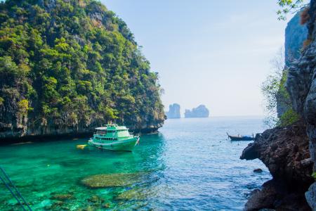 White Ship Sailed in Ocean Near Island