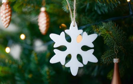 White Snow Flake Hanging on Christmas Tree