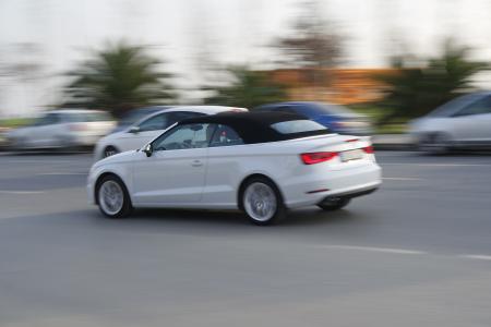 White Sports Convertible Coupe in the Middle of the Road