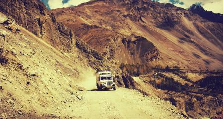 White Truck Riding on Brown Sandy Surface during Daytime