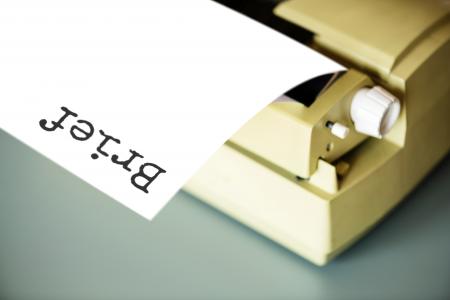 White Typewriter on Gray Table