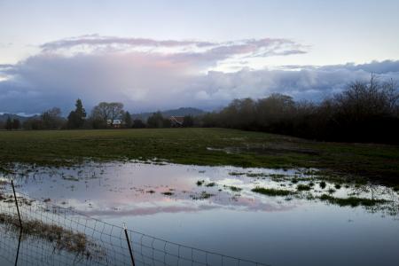 Winter sky reflected on water