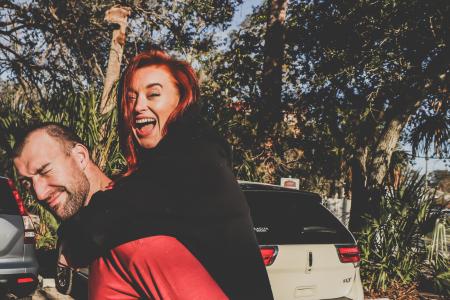 Woman Being Carried by Man Outdoor