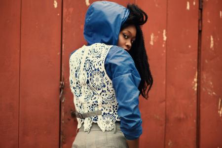 Woman Facing Brown Wooden Fence
