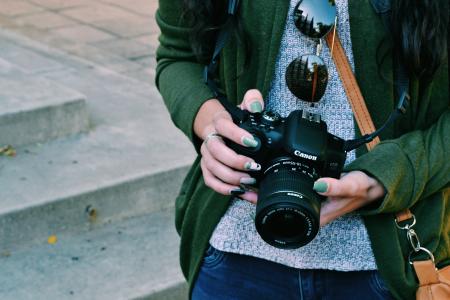 Woman Holding Black Canon Dslr Camera