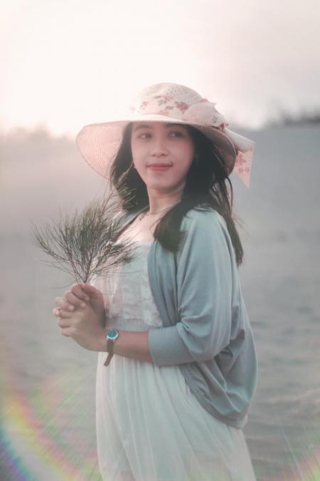 Woman Holding Brown Twig