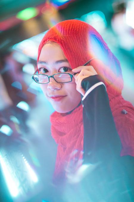 Woman Holding Her Black Framed Eyeglasses