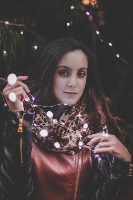 Woman Holding White String Lights