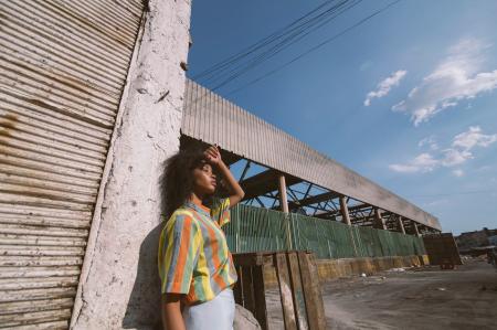 Woman in a Colorful Striped Shirt