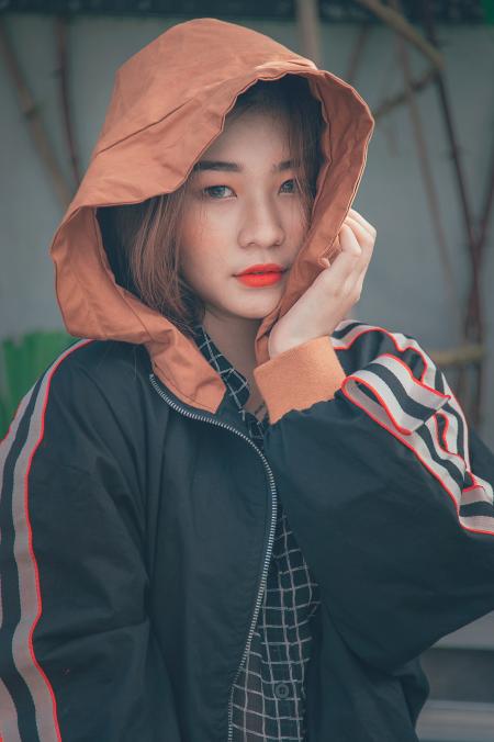 Woman in Black and Orange Zip-up Hoodie