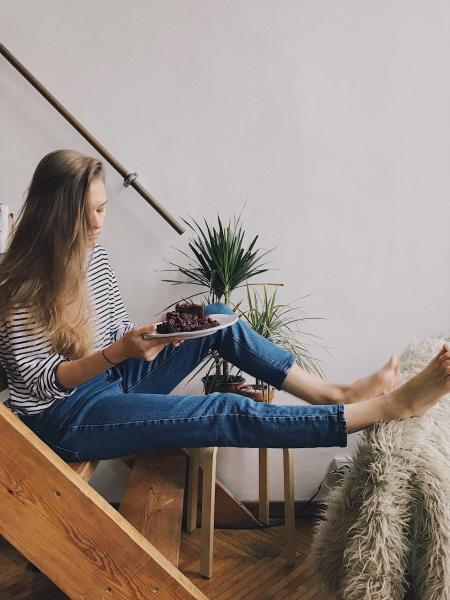 Woman in Black and White Striped Long-sleeved Top Holding White Ceramic Plate