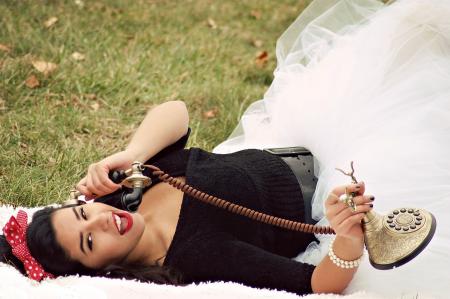 Woman In Black And White Tutu Dress Holding Cradle Phone