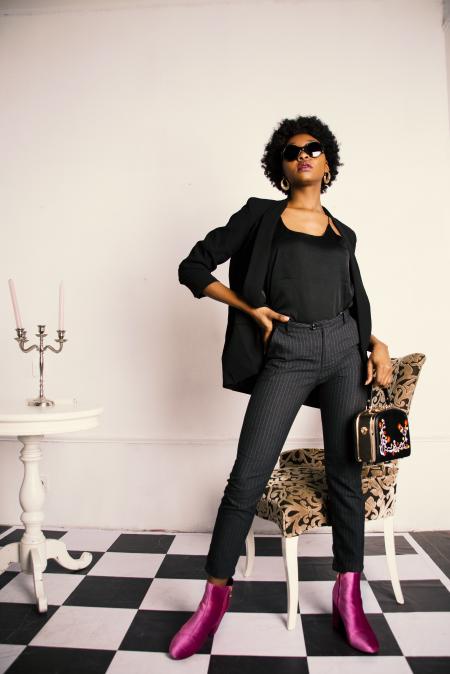 Woman in Black Blazer and Black Slacks With Purple Boots Photo