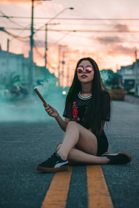 Woman In Black Crew-neck T-shirt Sitting On Concrete Roadway