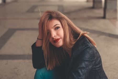 Woman in Black Leather Jacket Smiling