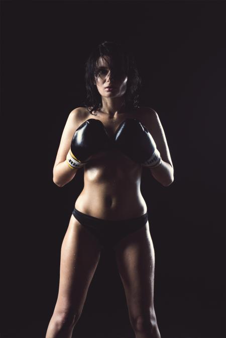 Woman in Black Panty Wearing Black Boxing Gloves Posing for Picture