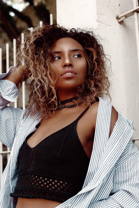 Woman in Black Spaghetti Strap Crop-top Posing for Photo