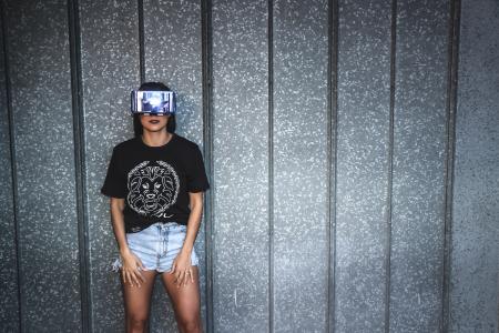 Woman in Black T-shirt Standing Near Gray Wall