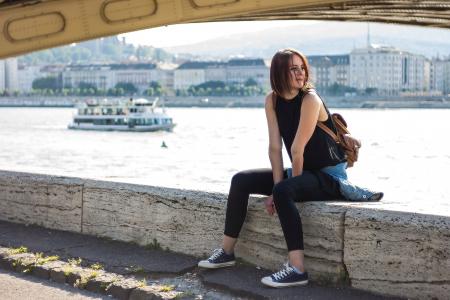 Woman in Black Tank Top and Black Leggings Sitting at Daytime