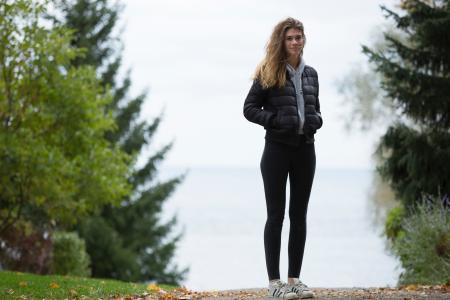 Woman in Black Winter Jacket Near Trees