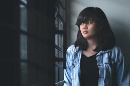 Woman in Blue Denim Jacket Indoors