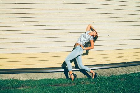 Woman in Blue Jeans and Stripes Crop Top