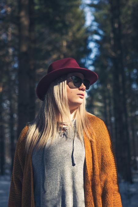 Woman in Brown Cardigan and Gray Top Near Green Leaf Trees at Daytime