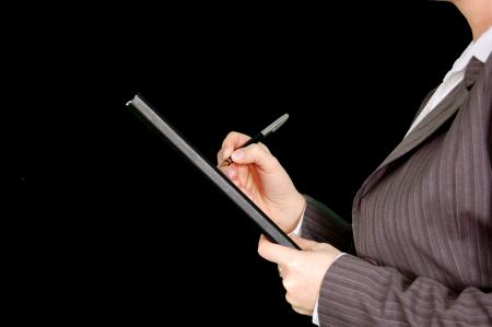 Woman in Gray Pinstripe Blazer Holding Black and Gray Stylus Pen and Black Pad