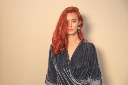 Woman in Gray Surplice Top Standing