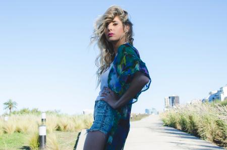 Woman in Green and Blue Cardigan