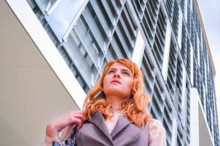 Woman in Grey Blazer Low Angle Photography Near Building