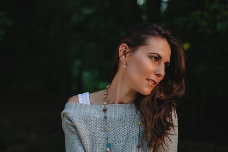 Woman in Grey Off Shoulder Sweater Staring in the Left Side of View