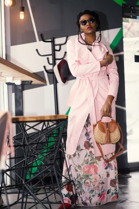 Woman in Pink Robe Holding Brown Leather 2-way Handbag