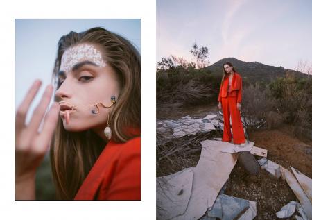 Woman in Red Jumpsuit Standing on Gray Rock