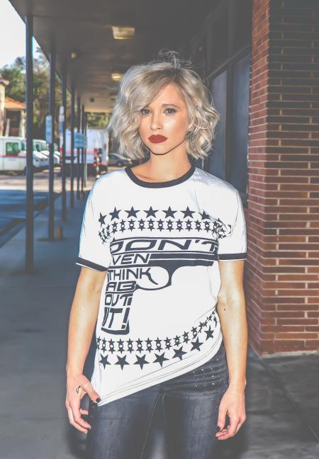 Woman in White and Black Gun-printed Crew-neck Shirt