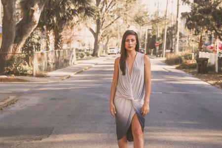 Woman in White and Blue V-neck Sleeveless Wrapped Dress