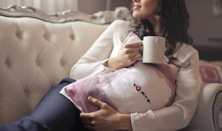 Woman in White Long-sleeved Shirt Holding White Ceramic Mug